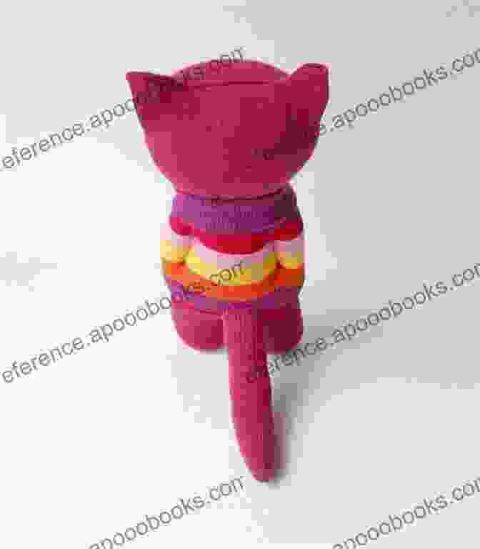 A Knitted Curious Cat Sock Creature With A Piercing Gaze, Vibrant Colors, And Mischievous Expression Sockology: 16 New Sock Creatures Cute Cuddly Weird Wild