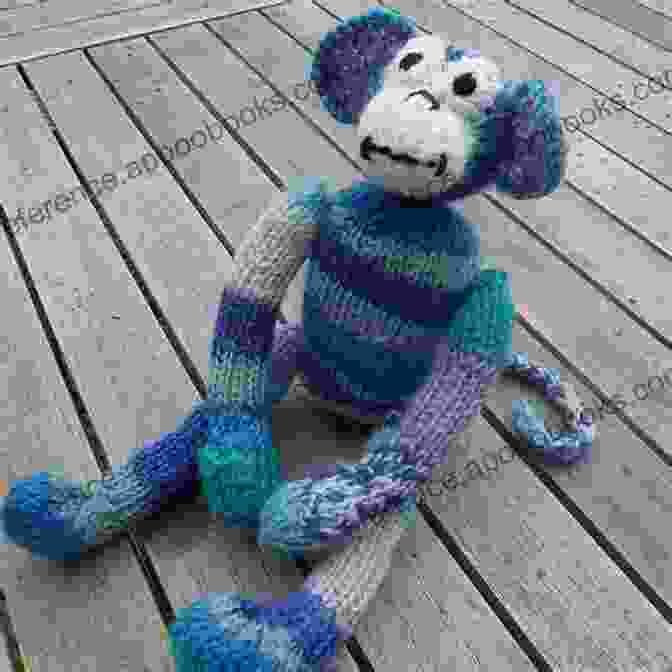 A Knitted Mischievous Monkey Sock Creature With A Playful Tail, Vibrant Colors, And Infectious Grin Sockology: 16 New Sock Creatures Cute Cuddly Weird Wild