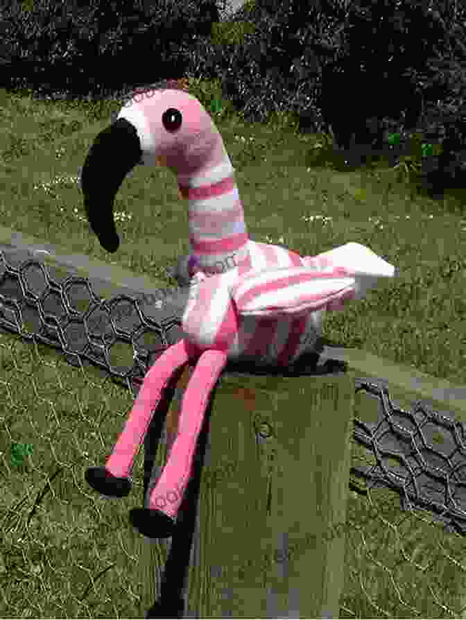 A Knitted Rosy Flamingo Sock Creature With A Long, Slender Neck, Vibrant Pink Feathers, And Graceful Posture Sockology: 16 New Sock Creatures Cute Cuddly Weird Wild