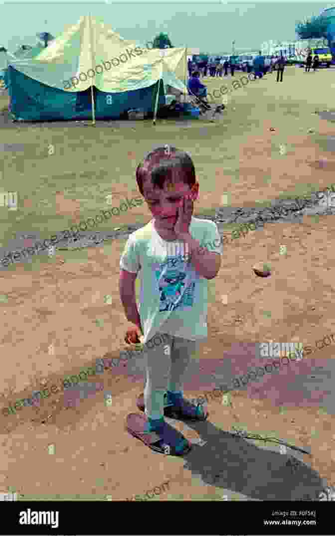 A Young Boy Sitting In A Refugee Camp, Looking Sad And Lost The Boy Who Said Nothing A Child S Story Of Fleeing Conflict