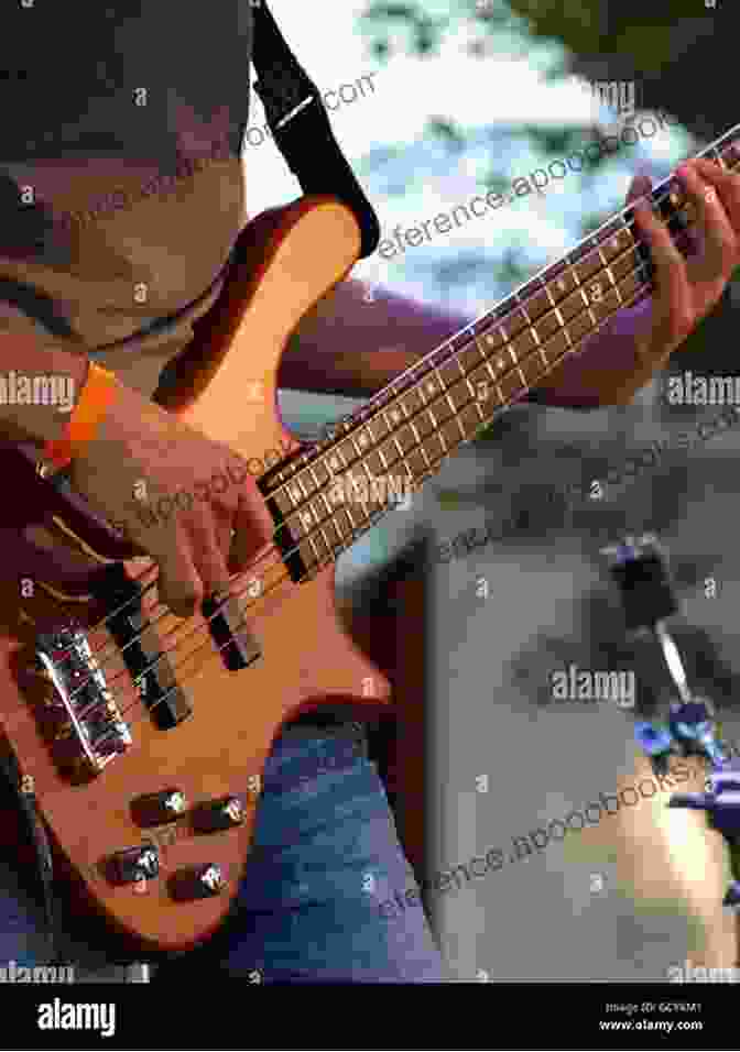 Photo Of A Bass Player Performing On Stage Country Bass Guitar Made Easy